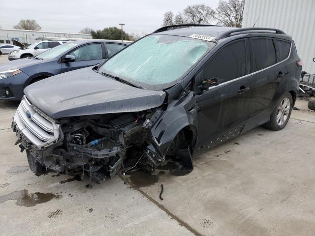 FORD ESCAPE SE 2018 with VIN 1FMCU0GD5JUB15578 - Photo from auction