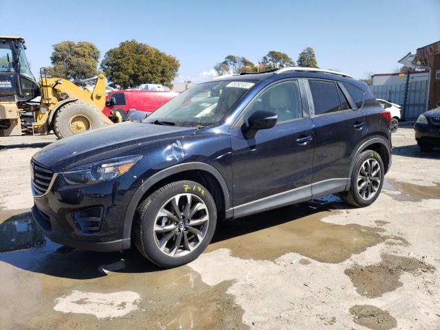 MAZDA CX-5 GT 2016 with VIN JM3KE2DY5G0819979 - Photo from auction