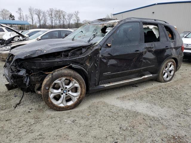 BMW X5 XDRIVE5 2011 with VIN 5UXZV8C5XBL420945 - Photo from auction