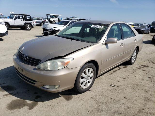 TOYOTA CAMRY LE 2004 with VIN 4T1BE30K84U857786 - Photo from auction