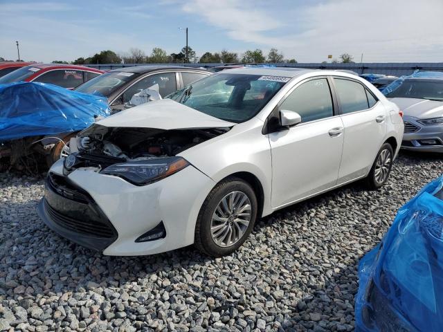 TOYOTA COROLLA LE 2018 with VIN 5YFBPRHE4JP763414 - Photo from auction
