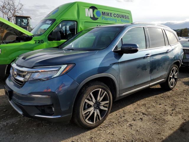 HONDA PILOT TOUR 2020 with VIN 5FNYF6H94LB034021 - Photo from auction