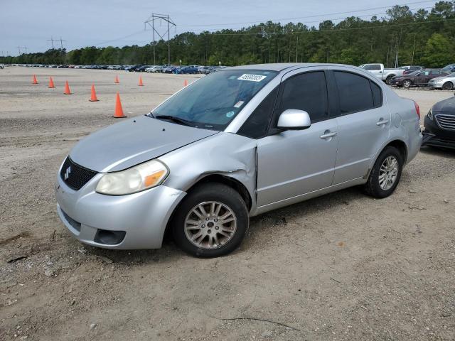 SUZUKI SX4 LE 2012 with VIN JS2YC5A32C6304745 - Photo from auction