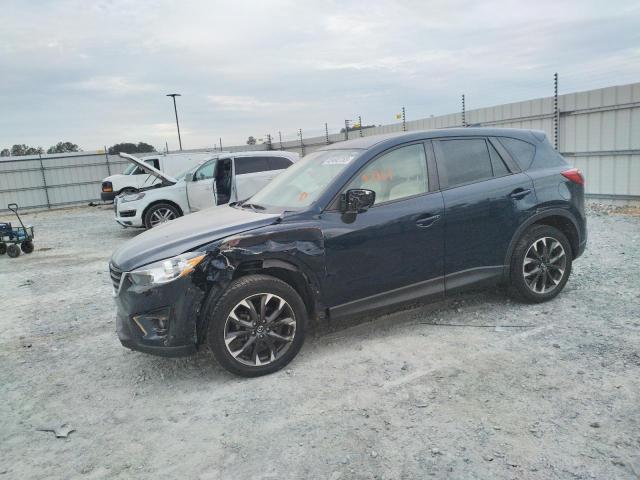 MAZDA CX-5 GT 2016 with VIN JM3KE2DY9G0780863 - Photo from auction