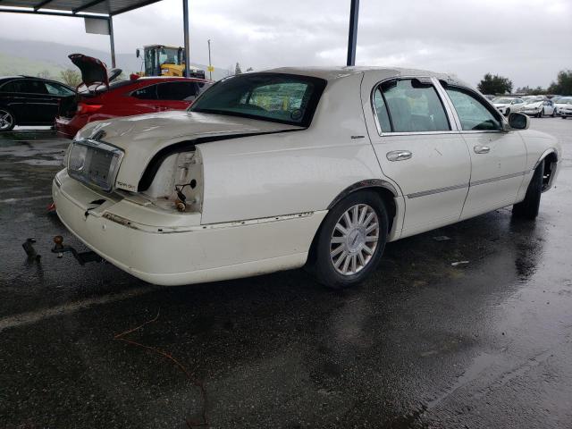 Photo 3 from auction – 2004 LINCOLN TOWN CAR E with VIN 1LNHM81W14Y650757