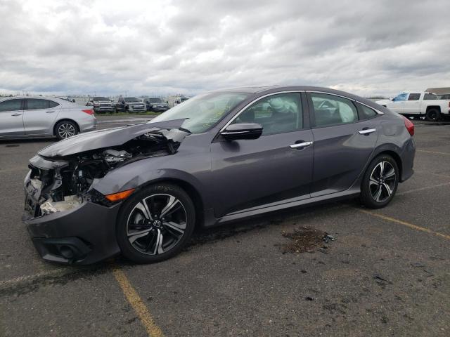 HONDA CIVIC TOUR 2016 with VIN 19XFC1F91GE218110 - Photo from auction