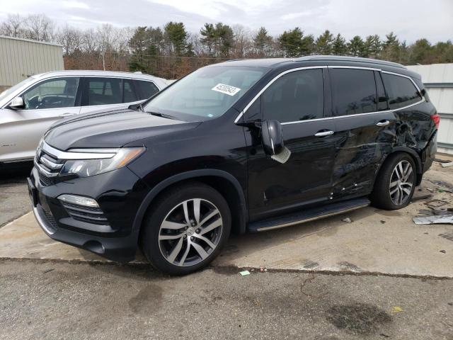 HONDA PILOT TOUR 2018 with VIN 5FNYF6H92JB066690 - Photo from auction