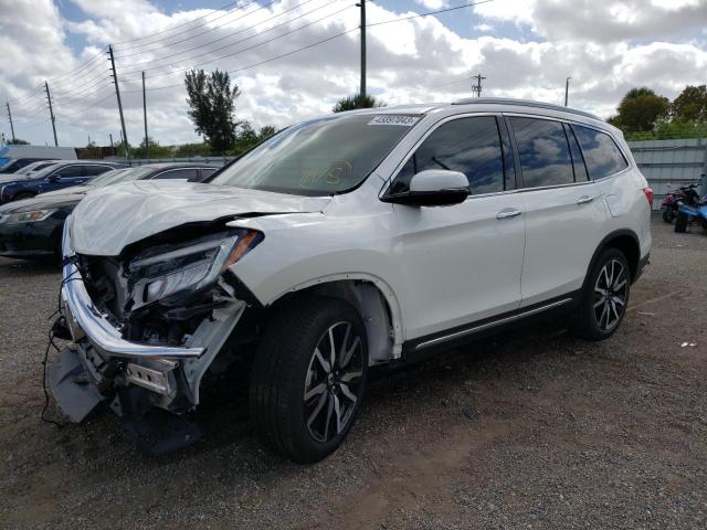 HONDA PILOT TOUR 2019 with VIN 5FNYF5H65KB011927 - Photo from auction
