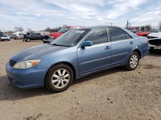 TOYOTA CAMRY LE 2002 with VIN 4T1BE30K92U597590 - Photo from auction