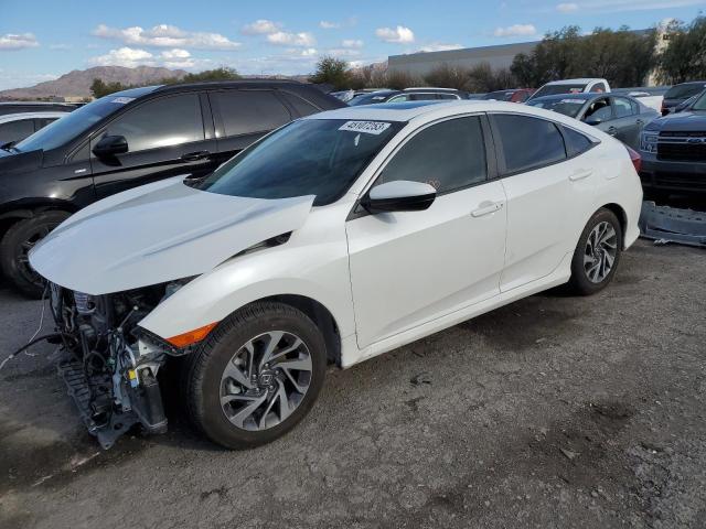 HONDA CIVIC EX 2018 with VIN 19XFC2F74JE039930 - Photo from auction