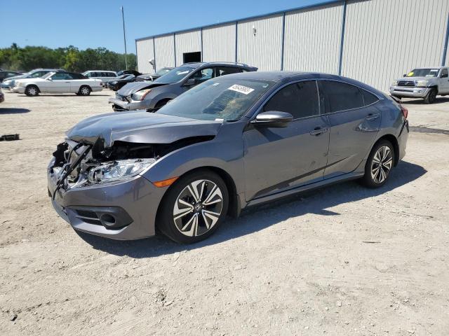 HONDA CIVIC EX 2018 with VIN JHMFC1F31JX036666 - Photo from auction