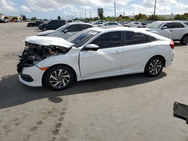 HONDA CIVIC EX 2018 with VIN 19XFC2F70JE015057 - Photo from auction