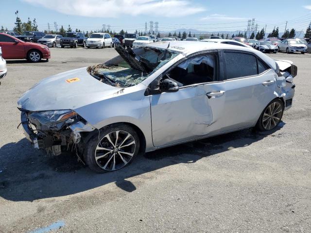 TOYOTA COROLLA L 2018 with VIN 5YFBURHE2JP789938 - Photo from auction