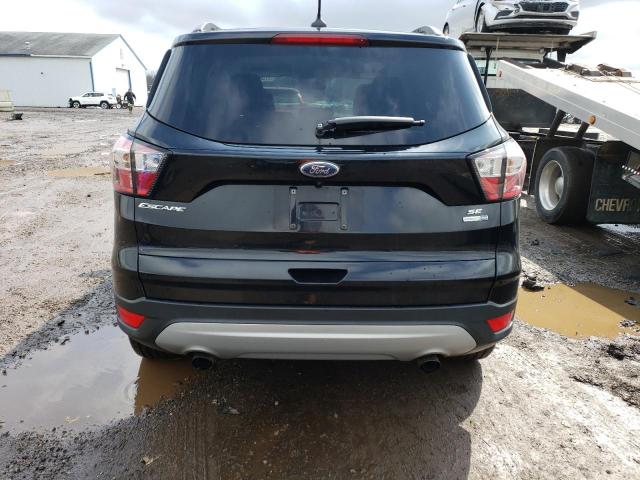 Photo 6 from auction – 2018 FORD ESCAPE SE with VIN 1FMCU9GD2JUD25608