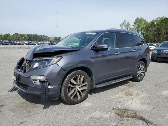 HONDA PILOT ELIT 2017 with VIN 5FNYF6H02HB036018 - Photo from auction