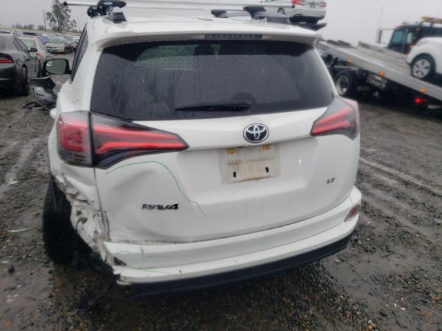 Photo 6 from auction – 2018 TOYOTA RAV4 LE with VIN JTMZFREV5JJ157680