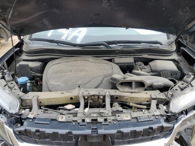 Photo 12 from auction – 2021 HONDA PILOT LX with VIN 5FNYF6H1XMB017672