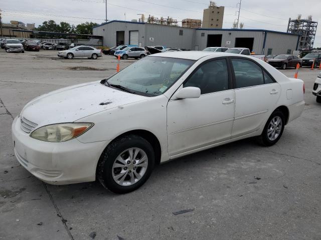 TOYOTA CAMRY LE 2004 with VIN 4T1BF32KX4U075550 - Photo from auction