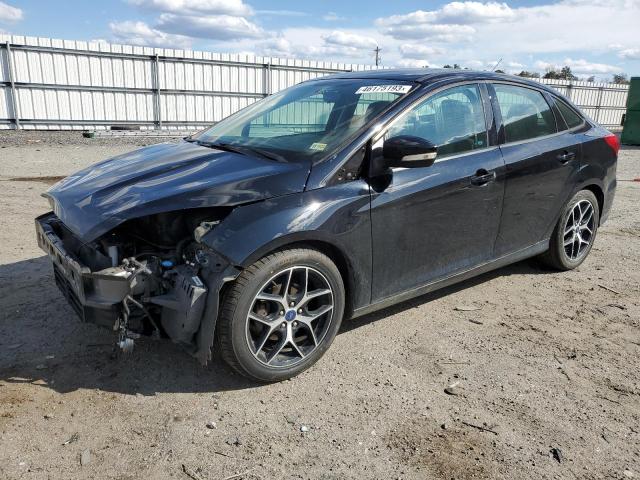FORD FOCUS SEL 2017 with VIN 1FADP3H24HL312889 - Photo from auction