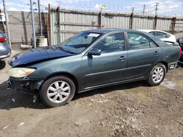 TOYOTA CAMRY LE 2004 with VIN JTDBF32K340155168 - Photo from auction