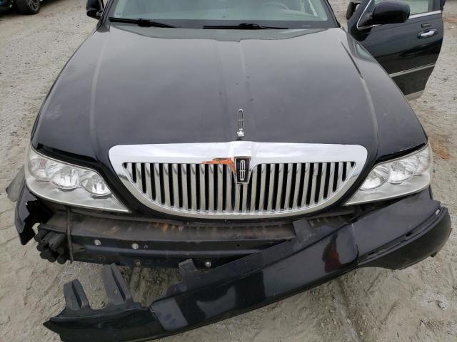 Photo 11 from auction – 2004 LINCOLN TOWN CAR U with VIN 1LNHM83W64Y680527