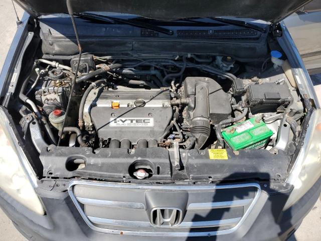 Photo 11 from auction – 2006 HONDA CR-V LX with VIN JHLRD68506C019463