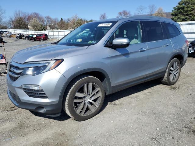 HONDA PILOT TOUR 2018 with VIN 5FNYF6H96JB034812 - Photo from auction