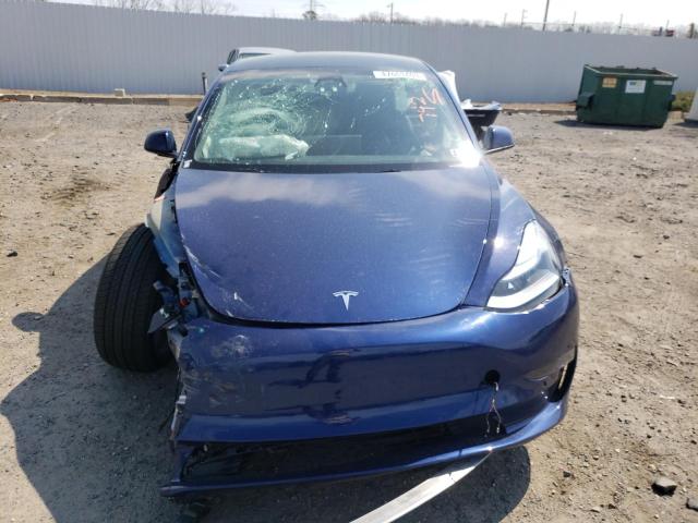 Photo 5 from auction – 2022 TESLA MODEL 3 with VIN 5YJ3E1EB8NF186104
