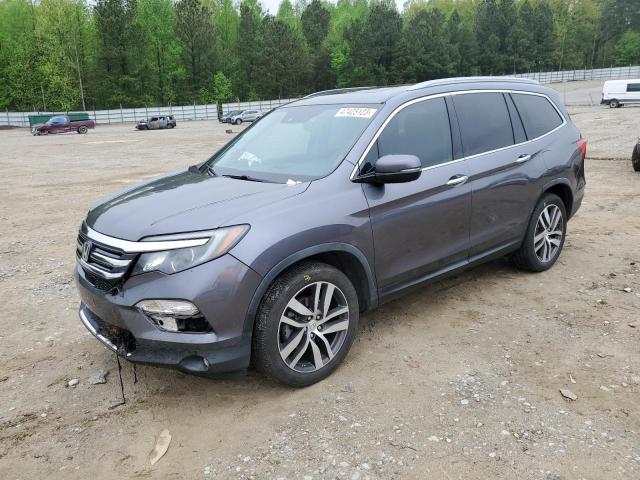 HONDA PILOT TOUR 2016 with VIN 5FNYF5H99GB023063 - Photo from auction