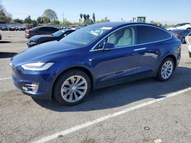 TESLA MODEL X 2018 with VIN 5YJXCBE22JF111938 - Photo from auction