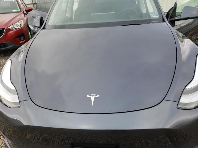 Photo 12 from auction – 2023 TESLA MODEL Y with VIN 7SAYGAEE5PF611231