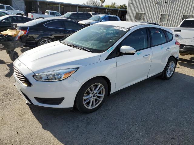 FORD FOCUS SE 2015 with VIN 1FADP3K21FL281929 - Photo from auction