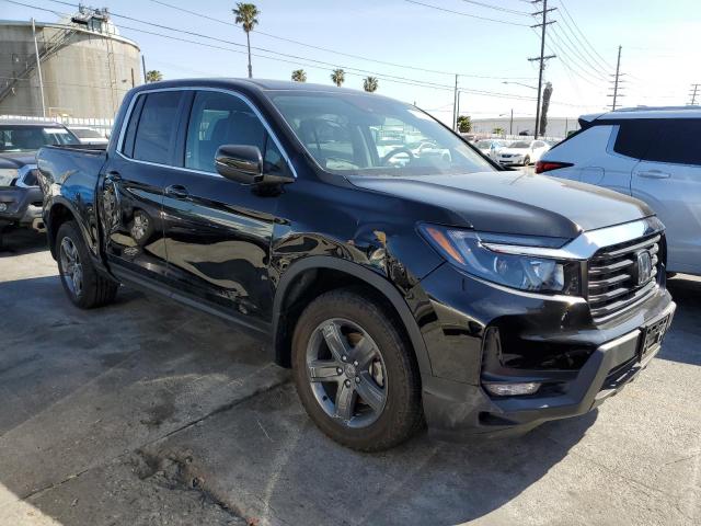 Photo 4 from auction – 2023 HONDA RIDGELINE with VIN 5FPYK3F58PB010585