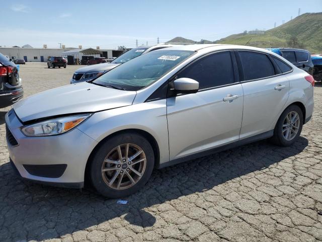 FORD FOCUS SE 2018 with VIN 1FADP3FE3JL304057 - Photo from auction