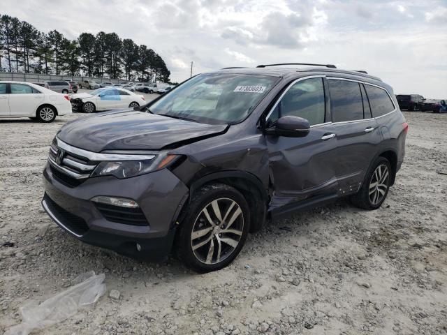HONDA PILOT TOUR 2017 with VIN 5FNYF6H96HB027238 - Photo from auction