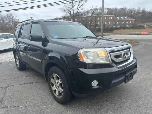 HONDA PILOT TOUR 2011 with VIN 5FNYF4H97BB007804 - Photo from auction