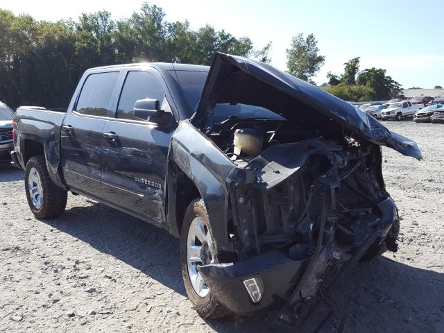 CHEVROLET SILVERADO 2018 with VIN 3GCUKREC9JG135865 - Photo from auction