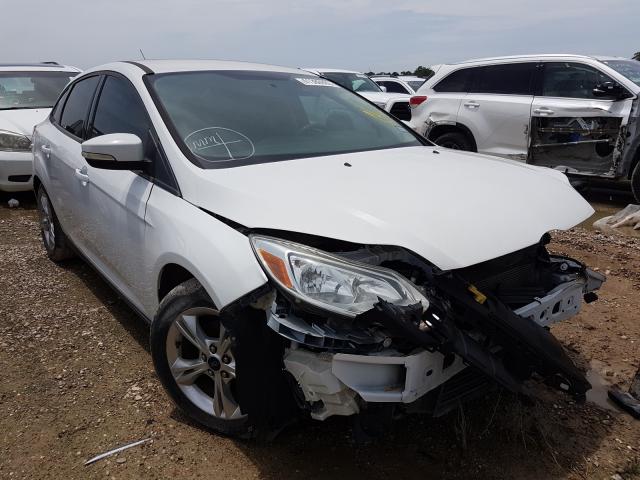 FORD FOCUS SE 2014 with VIN 1FADP3F23EL275980 - Photo from auction