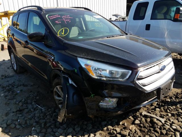 FORD ESCAPE SE 2018 with VIN 1FMCU9GD1JUA77710 - Photo from auction