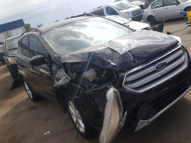 FORD ESCAPE SE 2018 with VIN 1FMCU9GD2JUB09323 - Photo from auction