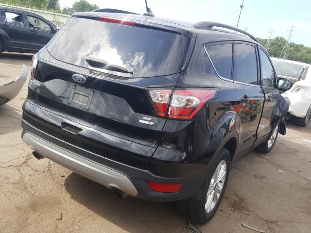 Photo 4 from auction – 2018 FORD ESCAPE SE with VIN 1FMCU9GD2JUB09323