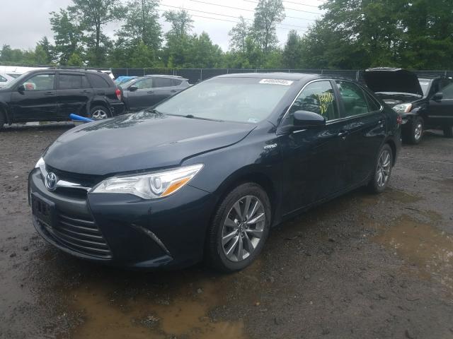 Photo 2 from auction – 2016 TOYOTA CAMRY HYBR with VIN 4T1BD1FK8GU192648