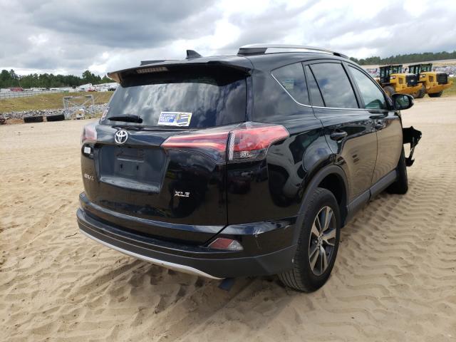 Photo 4 from auction – 2016 TOYOTA RAV4 XLE with VIN 2T3WFREV9GW240395