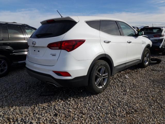 Photo 4 from auction – 2018 HYUNDAI SANTA FE with VIN 5NMZTDLB3JH106950
