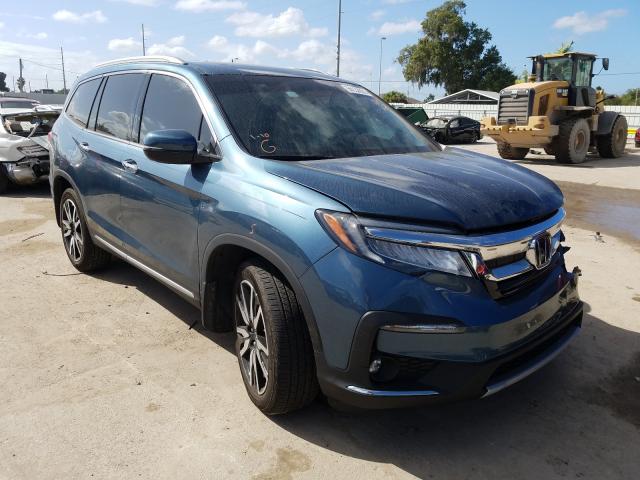 HONDA PILOT TOUR 2019 with VIN 5FNYF5H68KB041956 - Photo from auction