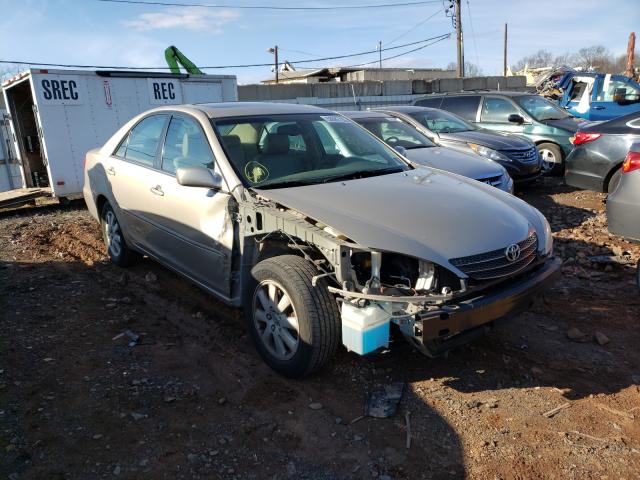 TOYOTA CAMRY LE 2004 with VIN 4T1BF32K14U577928 - Photo from auction