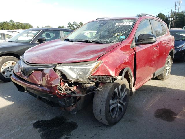 Photo 2 from auction – 2018 TOYOTA RAV4 LE with VIN JTMZFREV0JD112192
