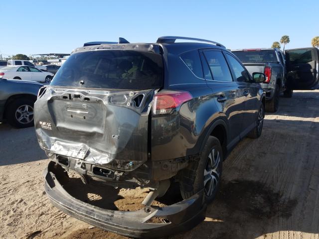 Photo 4 from auction – 2018 TOYOTA RAV4 LE with VIN 2T3ZFREV6JW458024