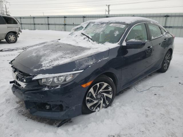 Photo 2 from auction – 2018 HONDA CIVIC EX with VIN 19XFC2F78JE004713