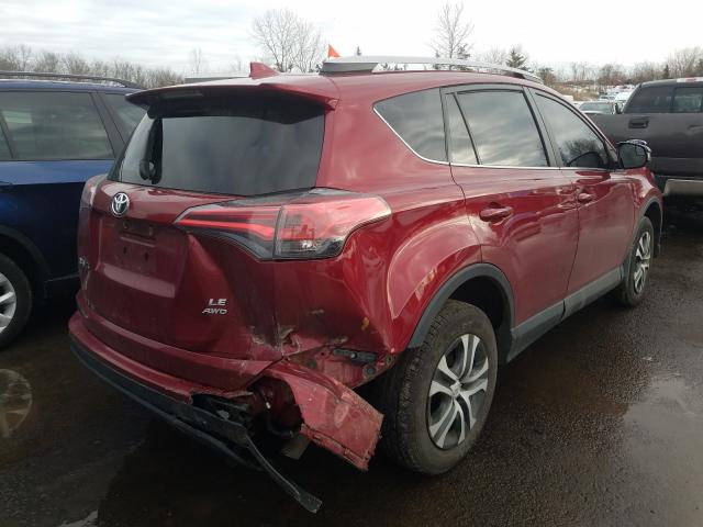 Photo 4 from auction – 2018 TOYOTA RAV4 LE with VIN 2T3BFREVXJW749689